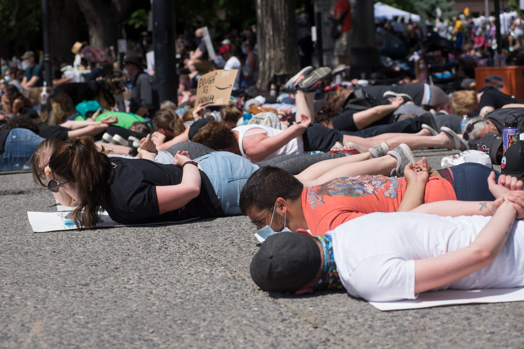 Protesters lie on their stomachs